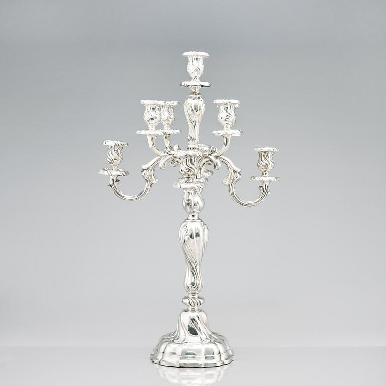 A pair of eight-light Louis XV-style silver candelabra, mark of Hermann Julius Wilm, Berlin, circa 1900.