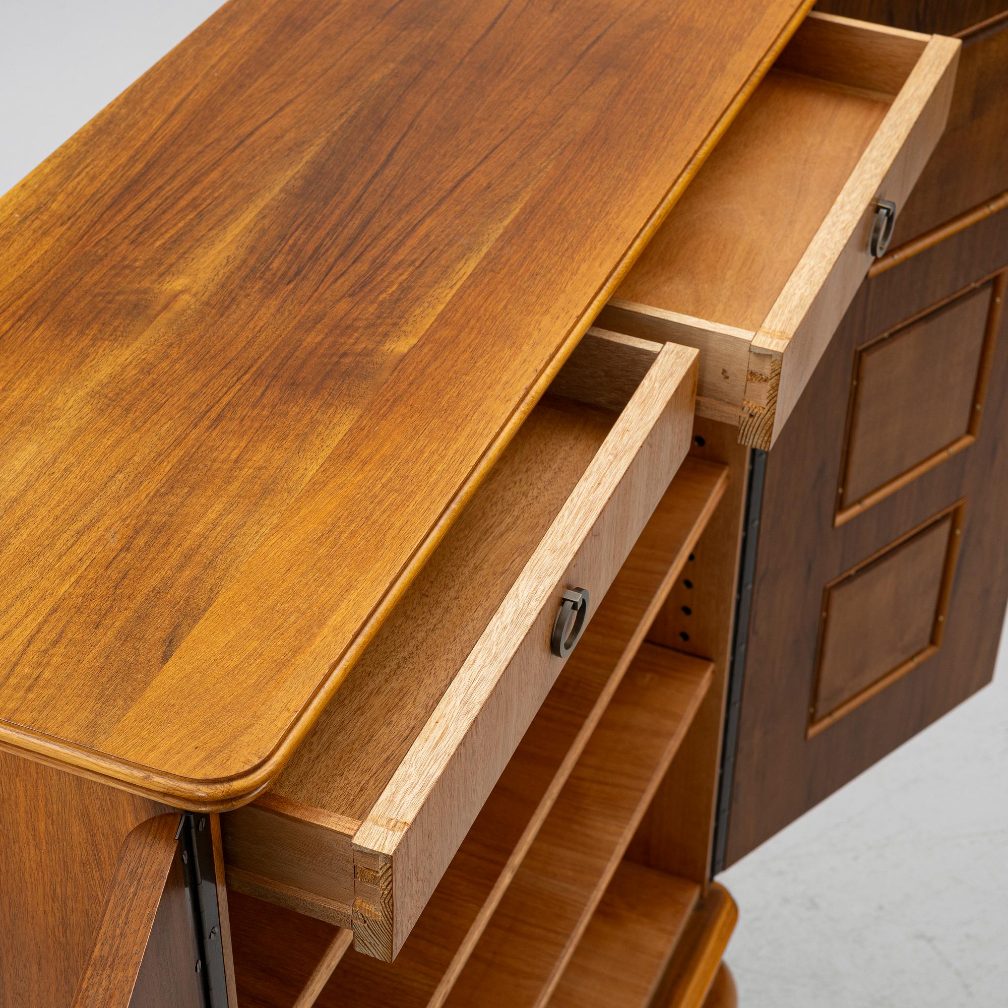 Eugen Höglund, a walnut cabinet, executed in his workshop in Vetlanda, Sweden 1950s.