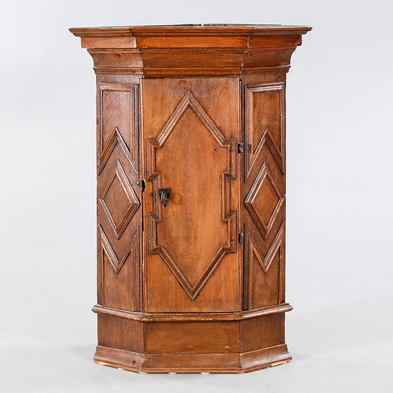 A 18th century corner cabinet.