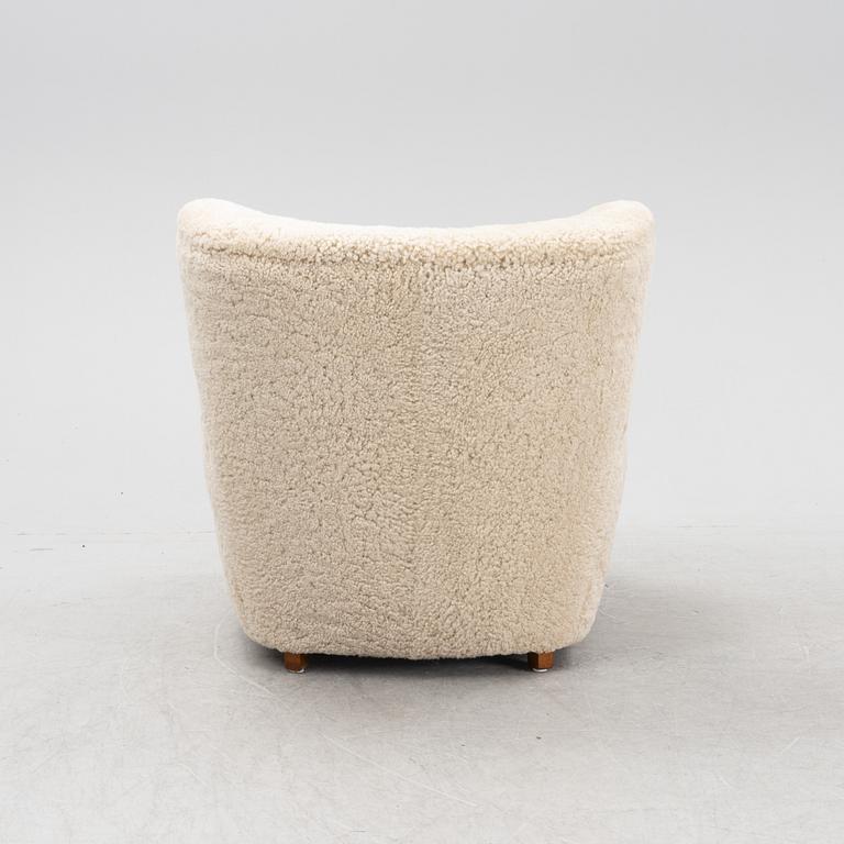 A lounge chair with new sheepskin upholstery, Denmark, 1940's.