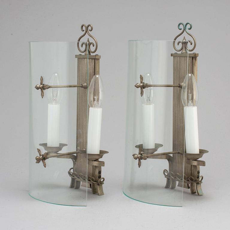 A pair of pewter wall lamps, 1920s.