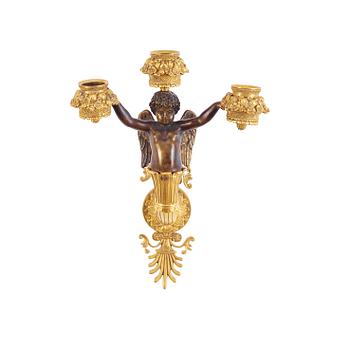 A pair of Empire early 19th century three-light wall-lights.