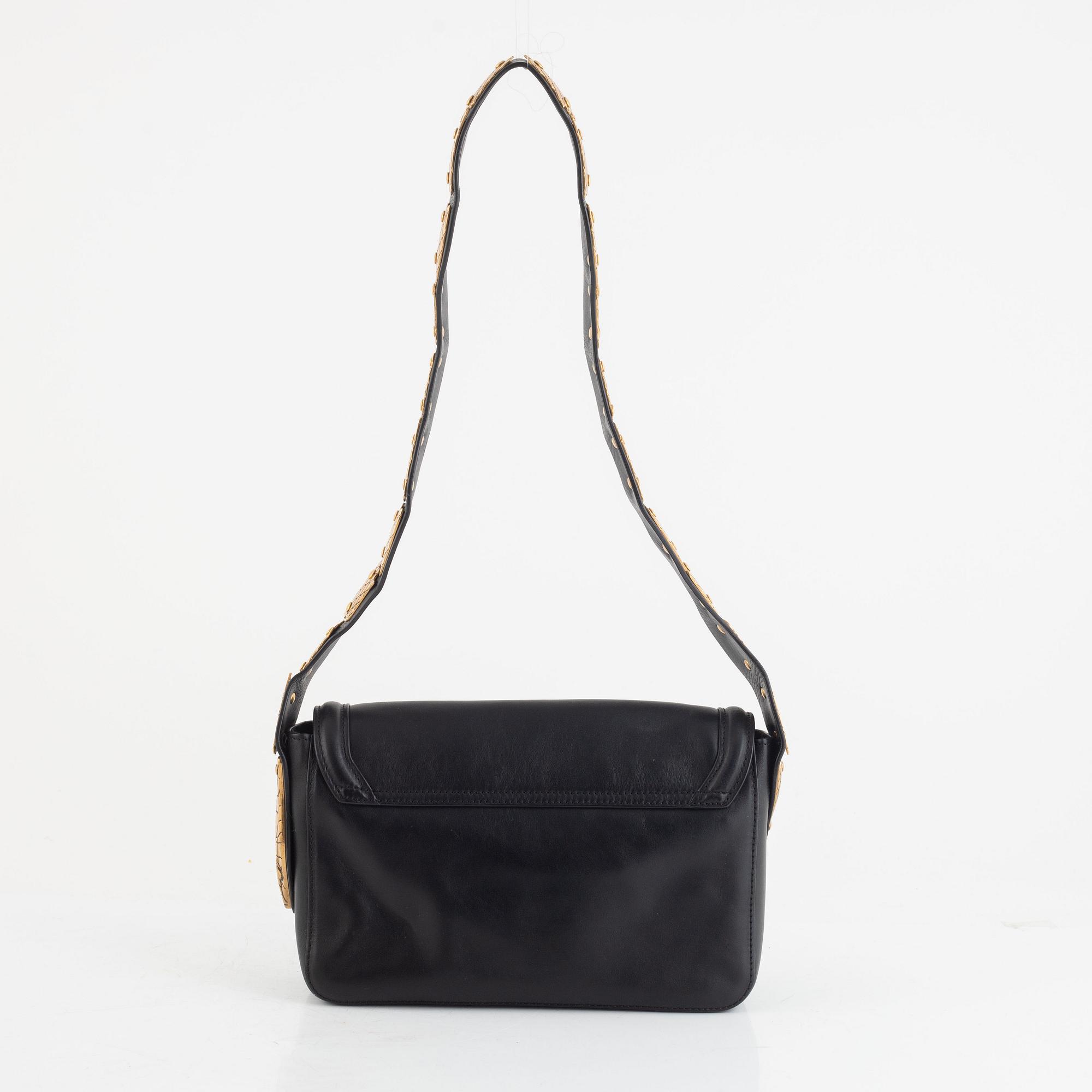 Valentino Red, A black leather snake bag.