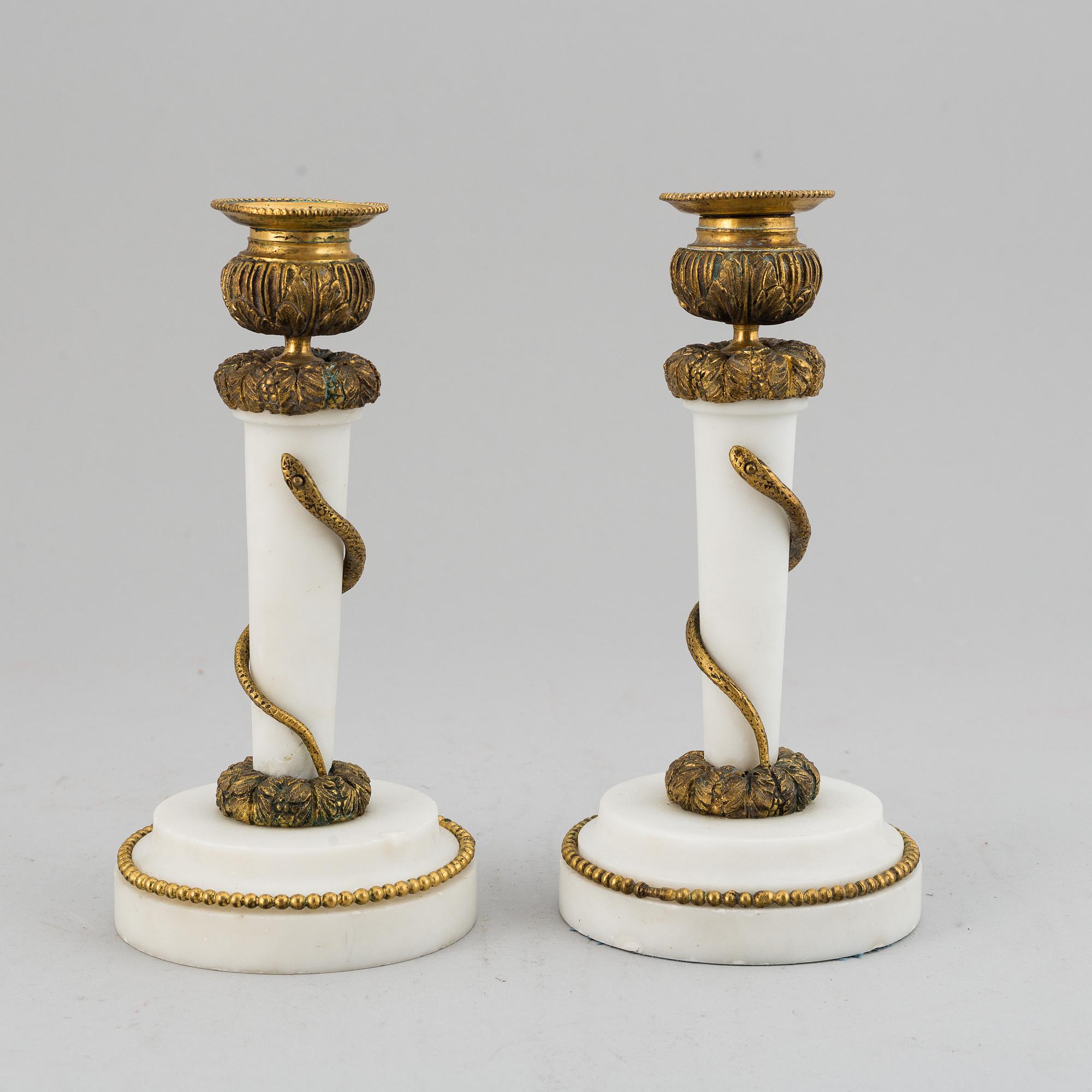 A pair of Louis XVI style candle sticks, circa 1900.