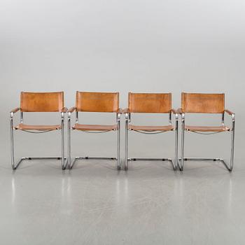 A set of four leather armchairs alter part of the 20th century.