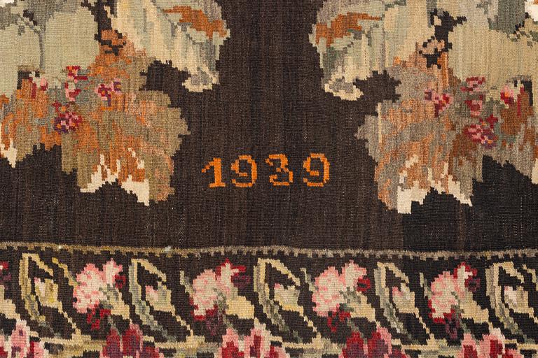 A Kelim carpet, Moldova, dated 1939, circa 385 x 174 cm.