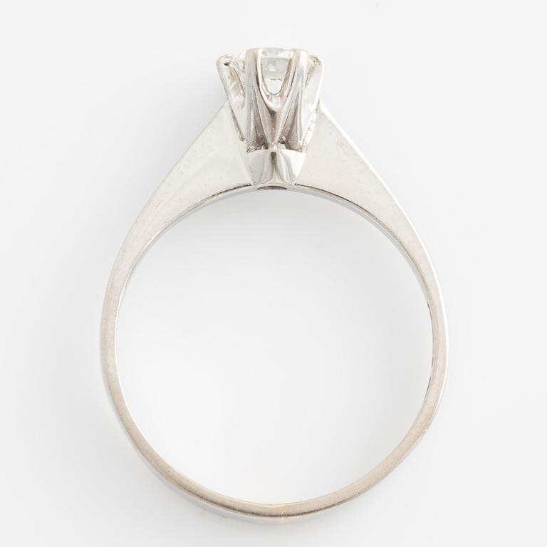 Ring solitaire with brilliant-cut diamond.