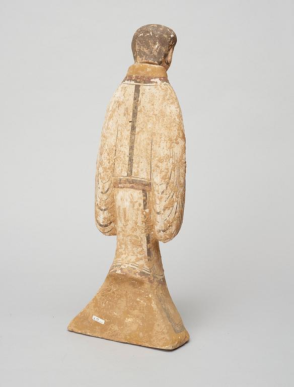 A painted pottery figure of a court attendant, Han Dynasty (206 BC-220 AD).