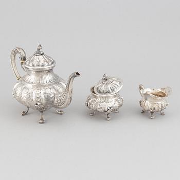 A silver teapot, creamer and sugar bowl, swedish import mark.
