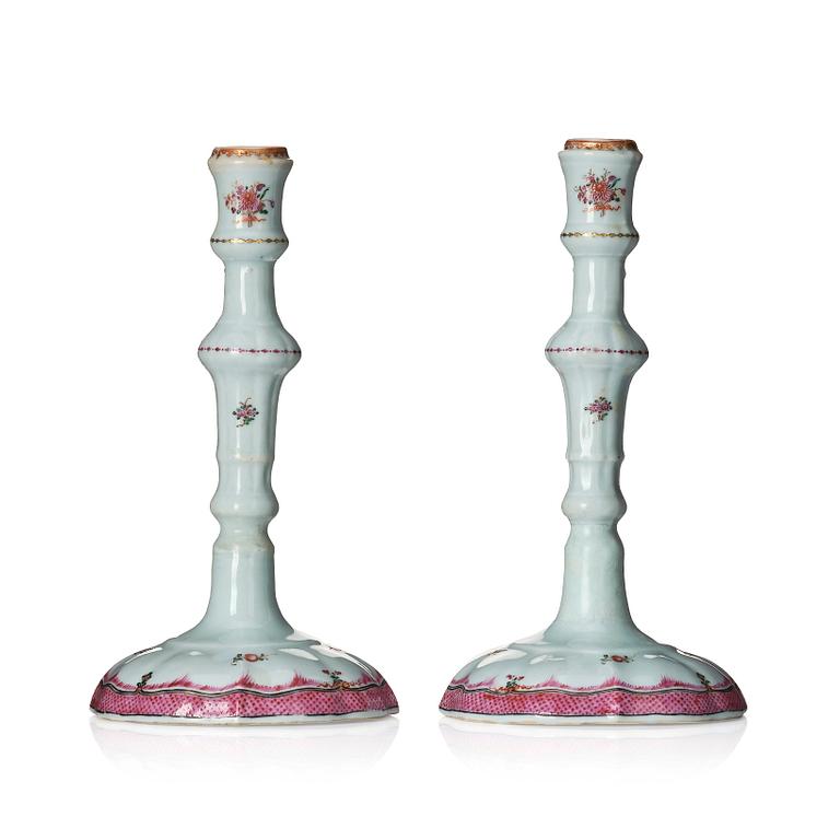 A pair of famille rose candle sticks, Qing dynasty, Qianlong (1736-95).