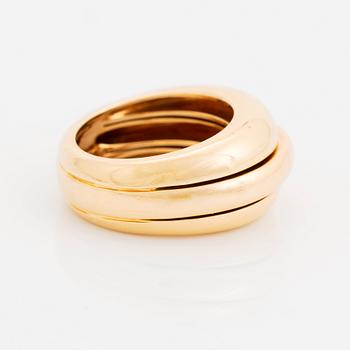 An 18K gold Cartier ring.