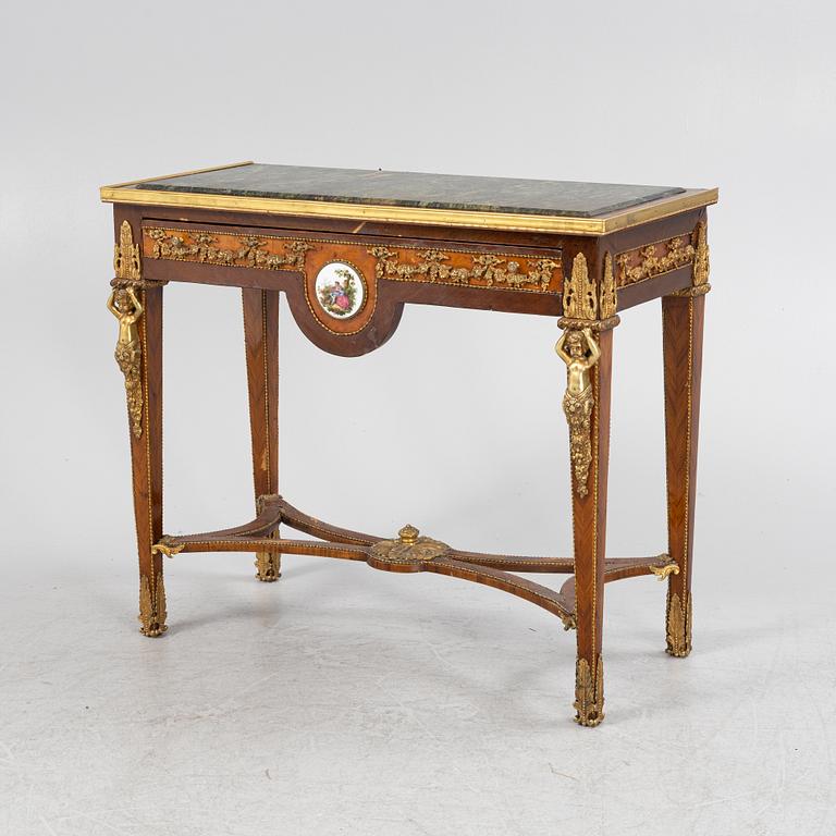 A Louis XVI-style gilt-brass mounted console table, circa 1900.