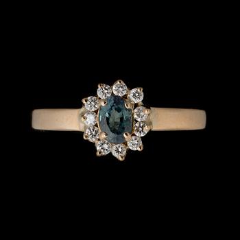 A RING, facetted alexandrite, brilliant cut diamonds, 18K gold.