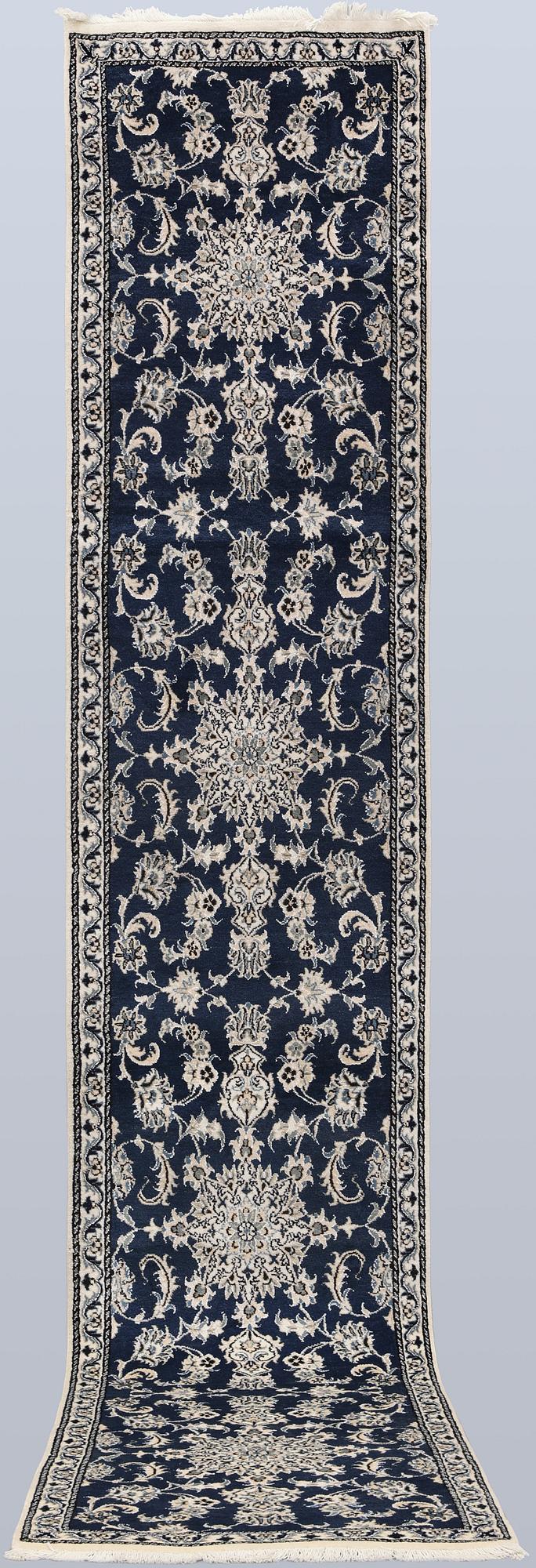 A Nain runner, part silk, approx. 405 x 77 cm.