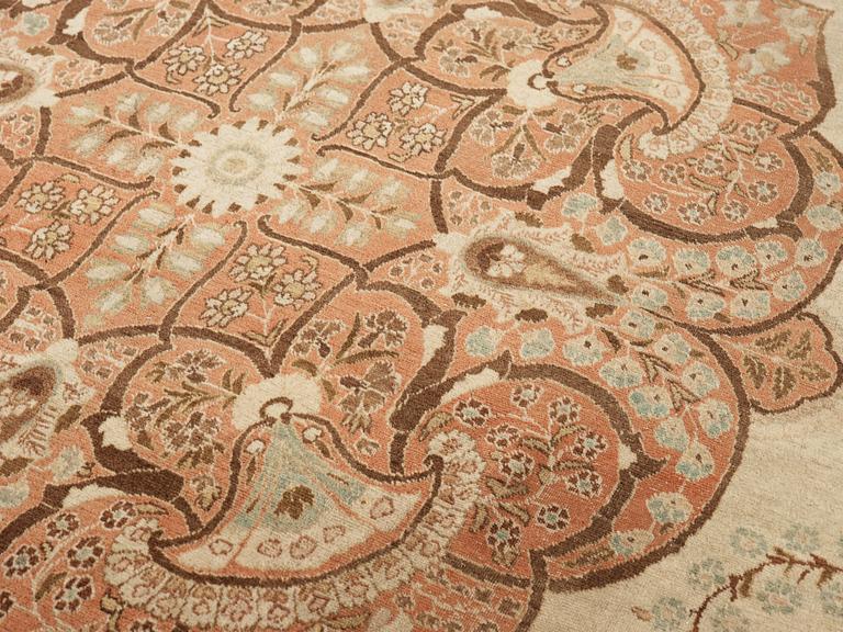 A CARPET. An antique Tabriz. 426 x 311 cm.