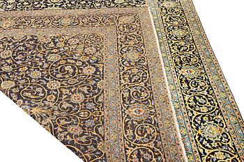 A Kashan carpet, a. 420 x 309 cm.