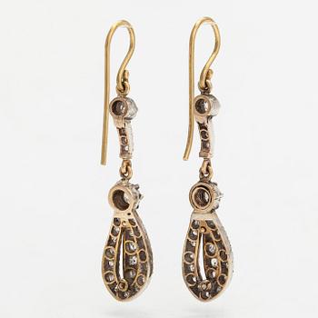 A pair of  gold and silver earrings with old and single-cut diamonds.