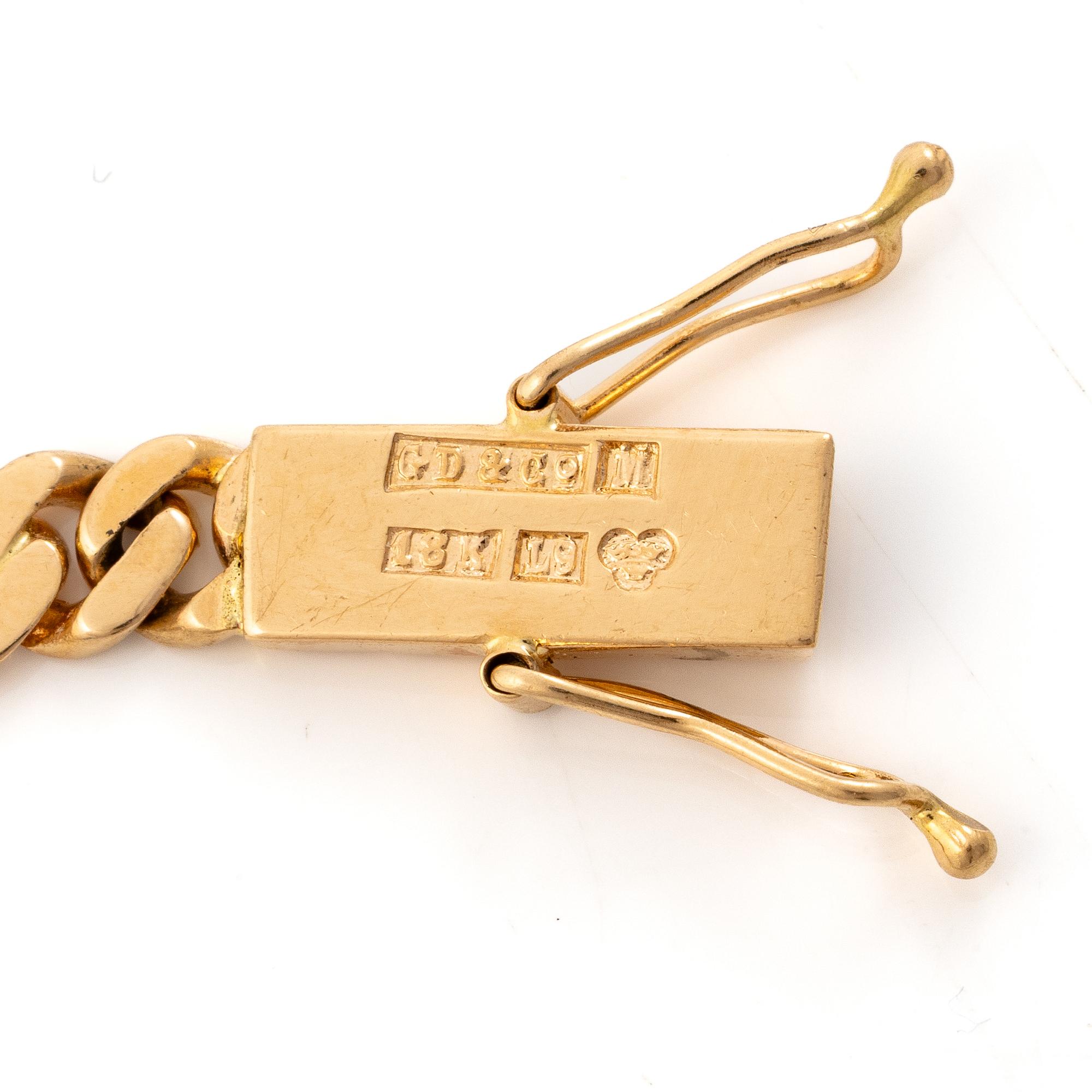 Gustaf Dahlgren & Co, Malmö, 1961. Bracelet in 18K gold with a centrepiece in 14K gold and garnets.