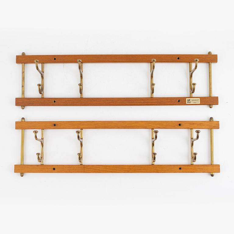 A pair of 'Dekorativ' coat hangers, Skoglunds metallgjuteri, Anderstorp, mid 20th Century.