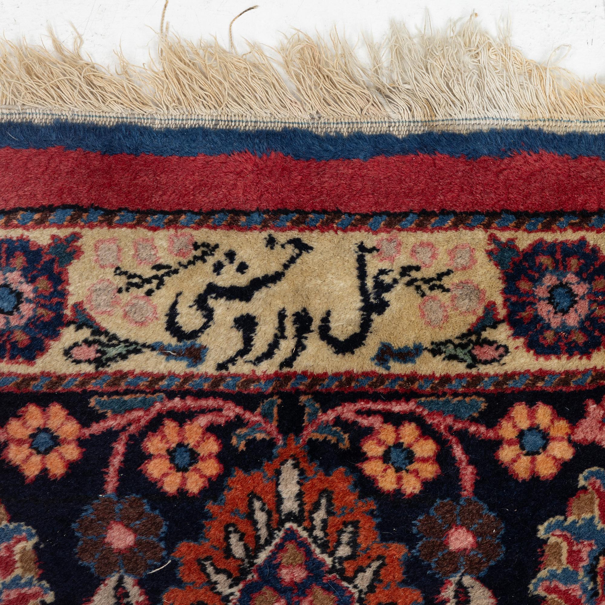 A semi-antique Mashad carpet, Eastern Iran, signed c. 507 x 303 cm.