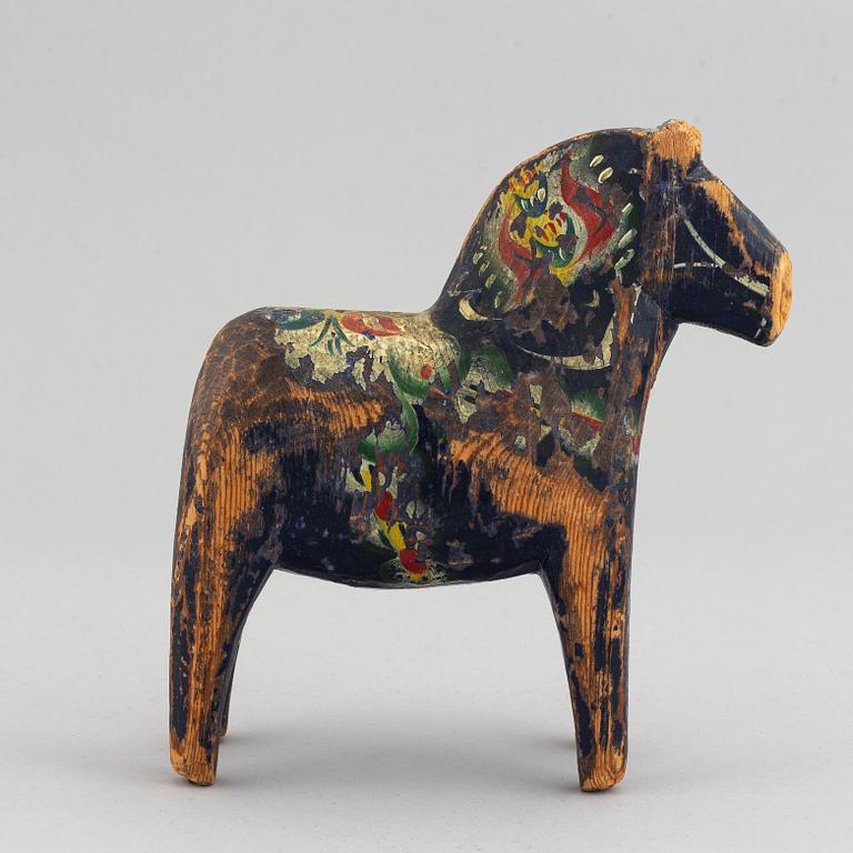 A set of 4 painted wooden horses from the first half of the 20th century.