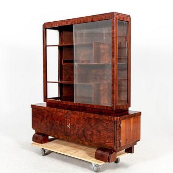 A walnut Art Deco early 1900s display cabinet.