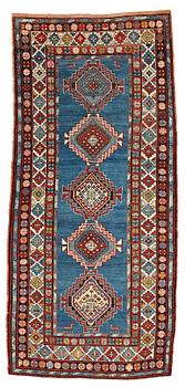 19. A RUNNER, a semi-antique Caucasian, ca 303,5 x 129,5-140,5 cm (as well as one end with 2,5 cm flat weave).