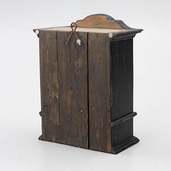 A Baroque wall cabinet, 18th Century.