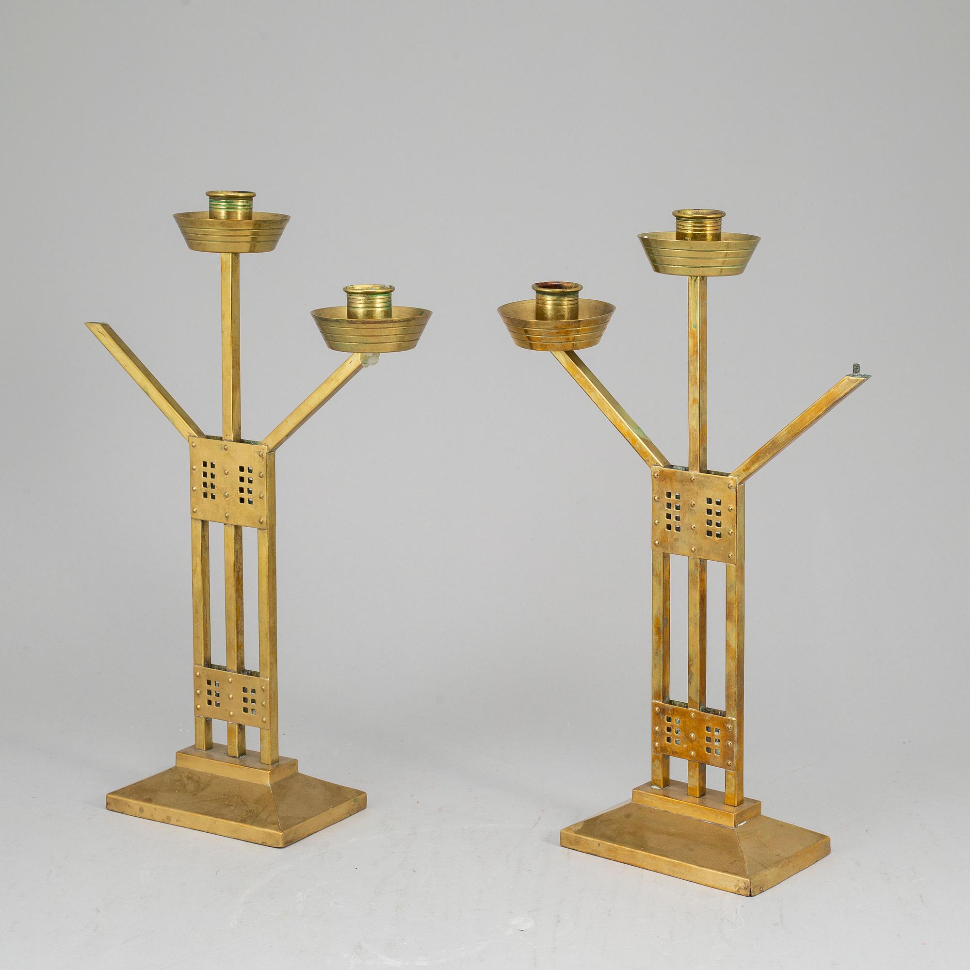 A pair of Art nouveau brass candelabra, early 20th Century.