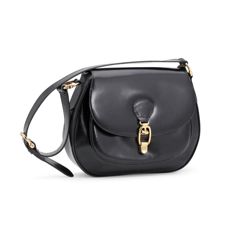 CÉLINE, a black leather shoulder bag.