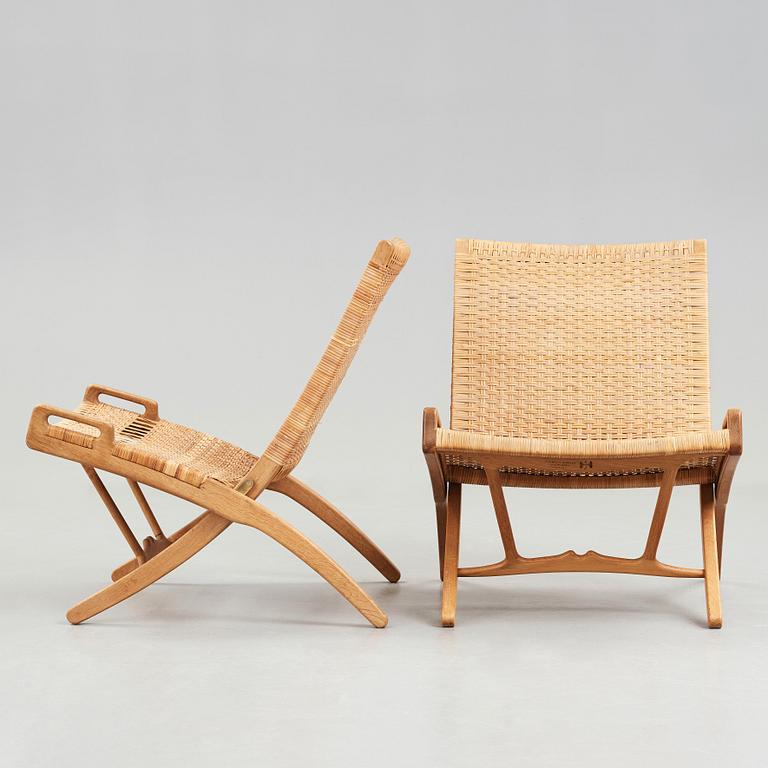 Hans J. Wegner, A pair of Hans J Wegner model 512 oak 'Folding Chairs' executed by Johannes Hansen, Denmark 1950's.