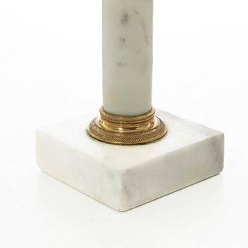 A pair of late Gustavian gilt brass and marble candlesticks, circa 1800.