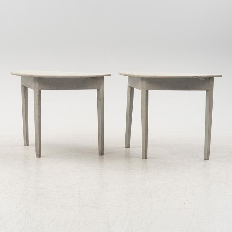 A pair of half circular tables, 19th Century.