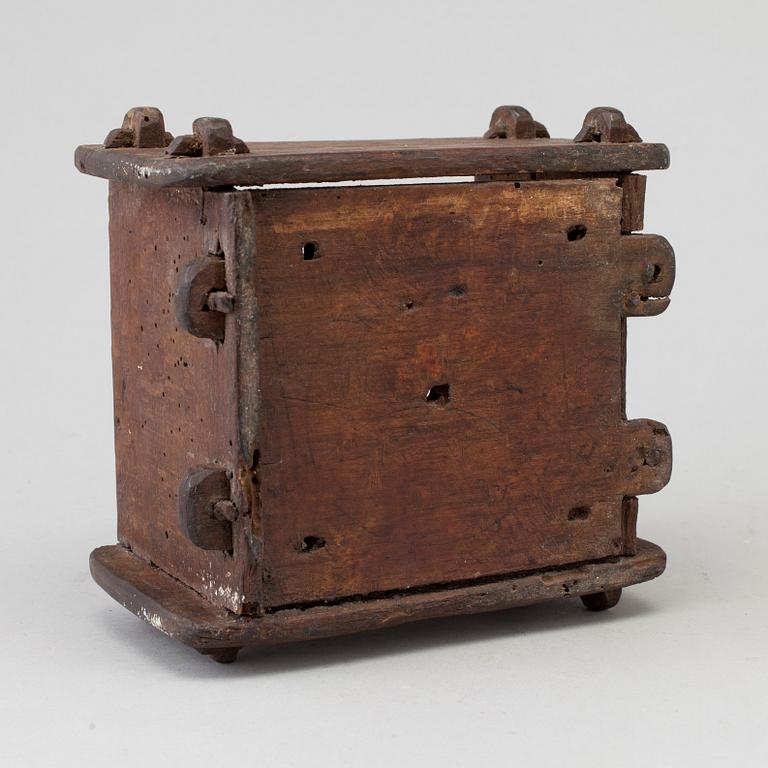 A cheese mould, dated 1768.