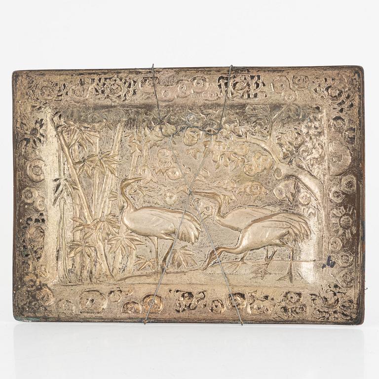 A Chinese copper relief, 20th century.