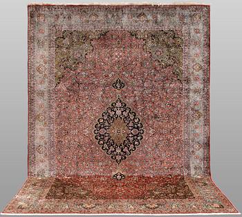 A silk Ghom carpet, 300 x 208 cm.