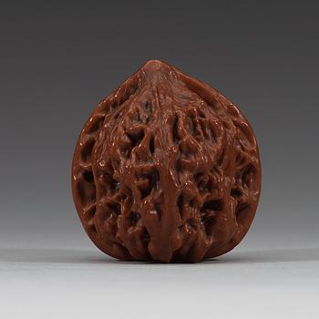 Two pairs of carved walnut hand exercisers, late Qing dynasty (1644-1912).