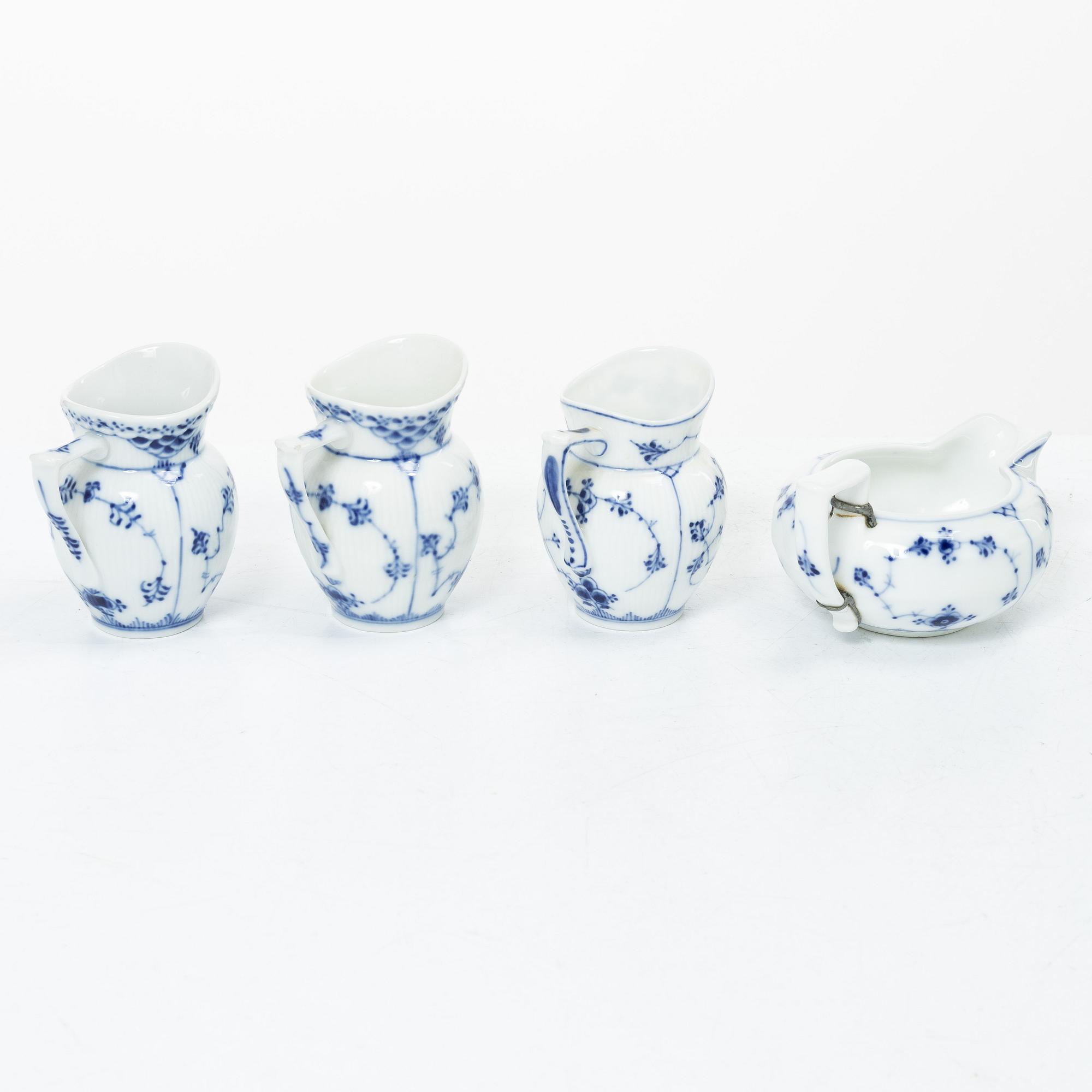 Royal Copenhagen, Lot of porcelain, 7 pieces, “Musselmalet”, coffee pot, chocolate pot, water jug, sauce boat, 3 cream jugs, 20th century.