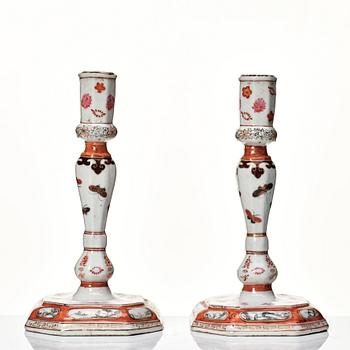 A pair of rouge de fer and grisaille export candle sticks, Qing dynasty, Qianlong (1736-95).