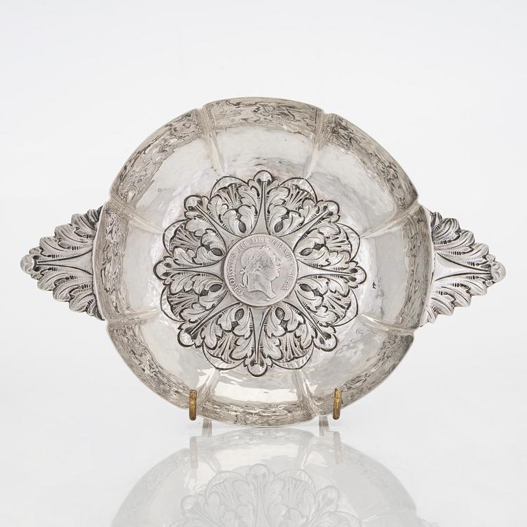 A 20th-century silver dish with a 3 shilling coin dated 1813.