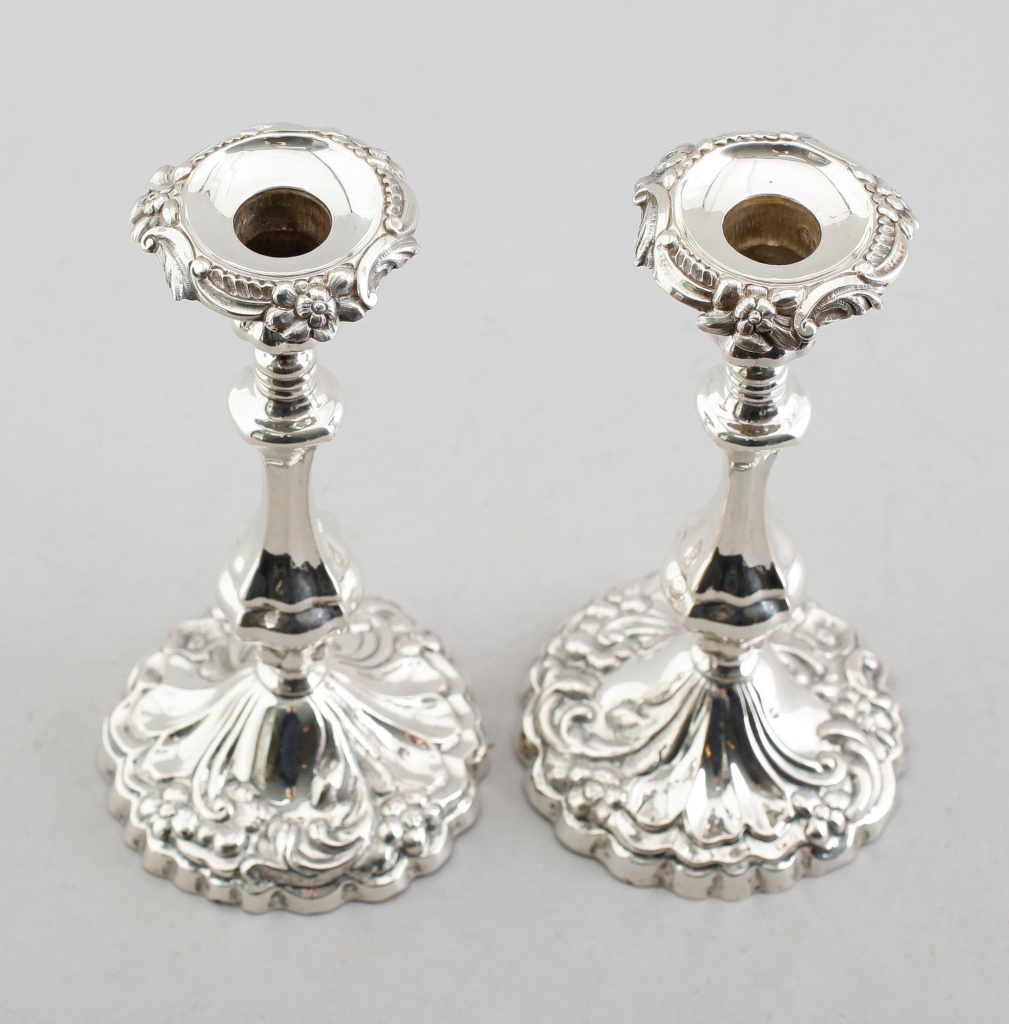 LJUSSTAKAR, ett par, silver, 1861.