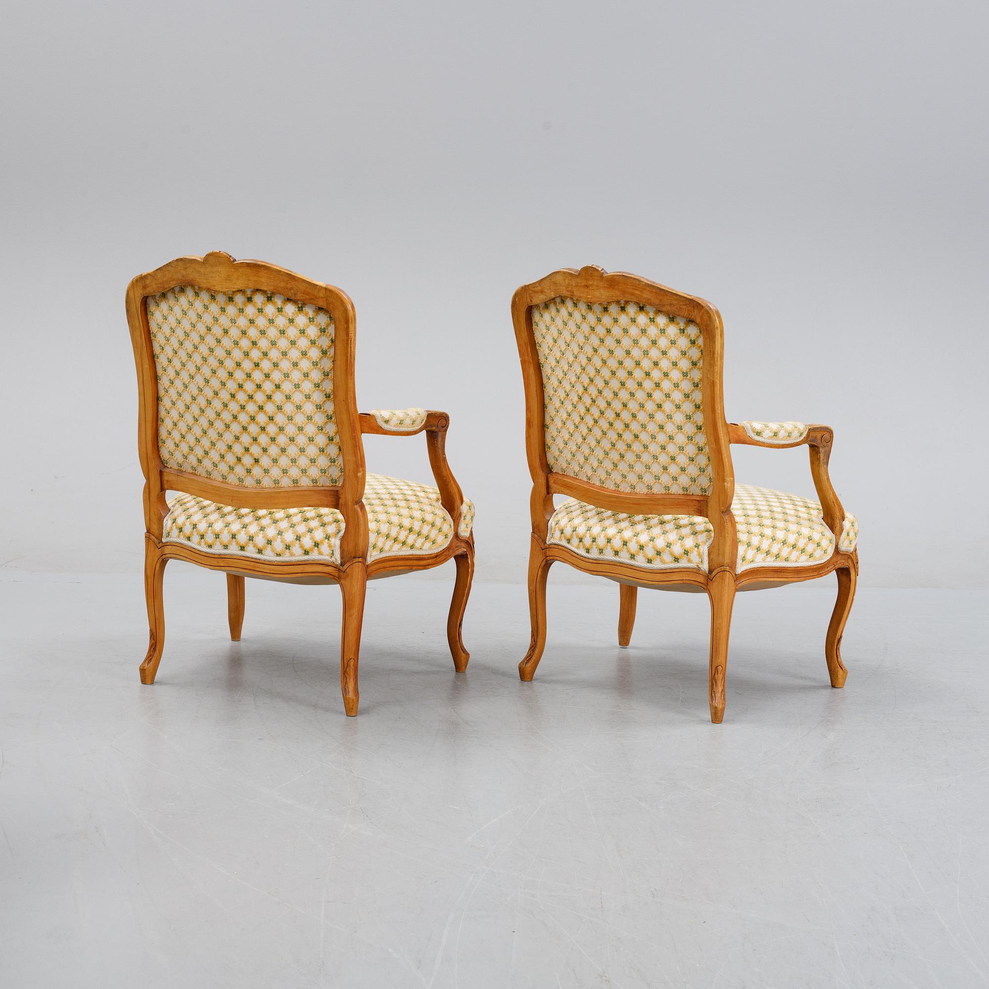 A pair of rococo style armchairs, early 20th Century.