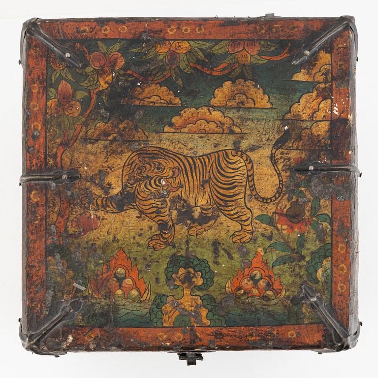 A Tibetan patinated lacquered wooden box, 20th century.