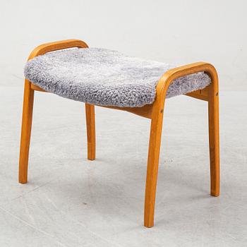 Yngve Ekström, a 'Lamino'  shearling upholstered lounge chair and foot stool from Swedese.