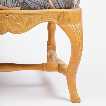 A pair of rococo open-back armchairs, Stockholm, later part 18th century.