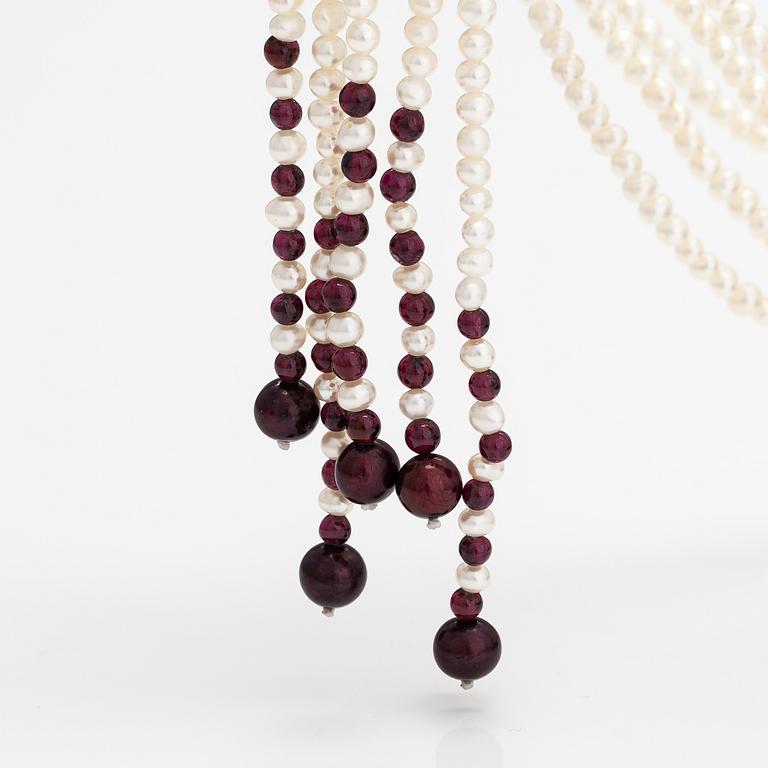 A sweet water, rose quartz, garnet and wood pearls collier with a Tiffany & co silver ring designed by Elsa Peretti.