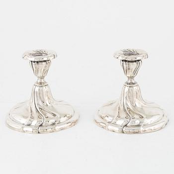 A pair of silver Rococo-style candelabra, Germany, first half of the 20th century.