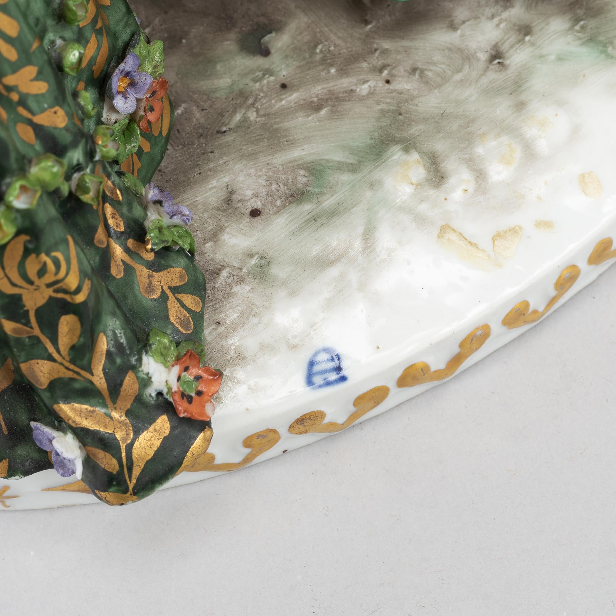 A rokoko style porcelain figurine group, Europe, early 20th century.