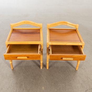 A pair of 1980s Dux rattan bedside tables.