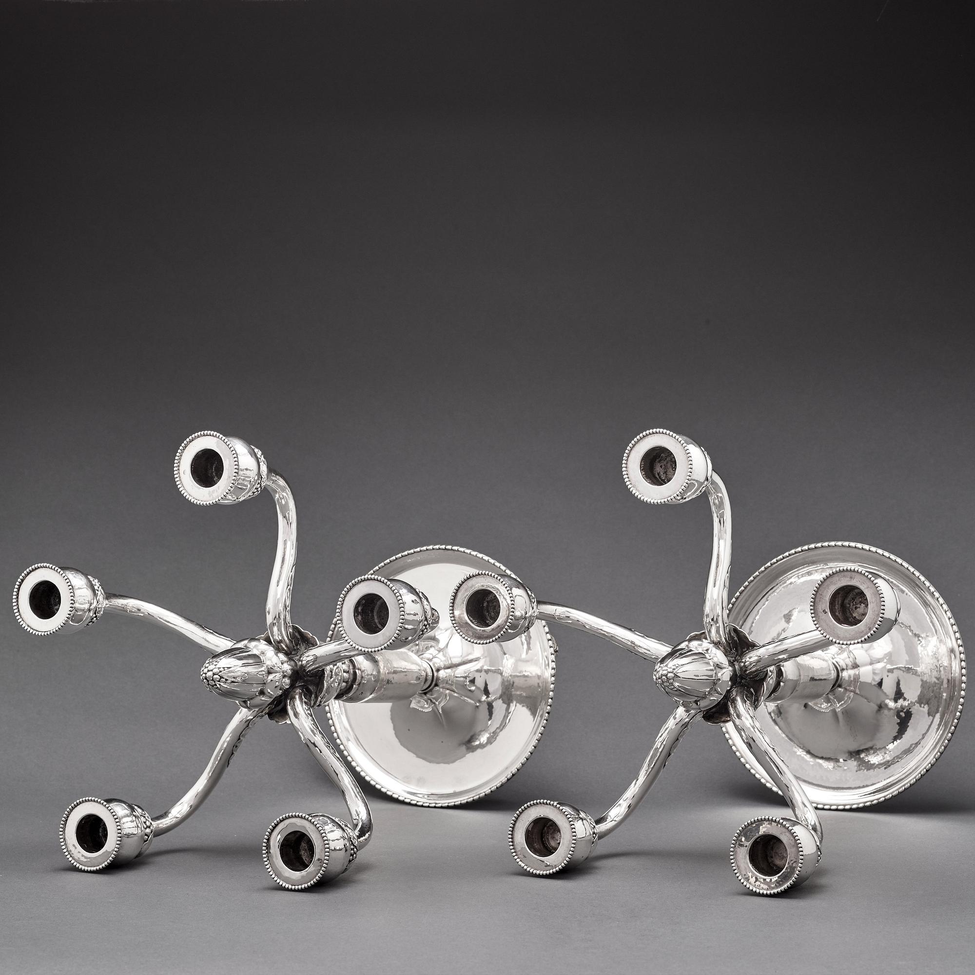 Georg Jensen, a pair of 830/1000 silver five light candelabra, Copenhagen 1920, design nr 200.